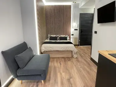 Una televisión o centro de entretenimiento en Plaza Mayor de Salamanca Apartamentos