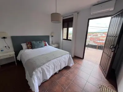 Cama o camas de una habitación en El senorio de Valdepusa