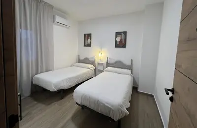 Cama o camas de una habitación en Casa rural Macondo
