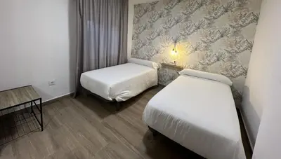 Cama o camas de una habitación en Casa rural Macondo