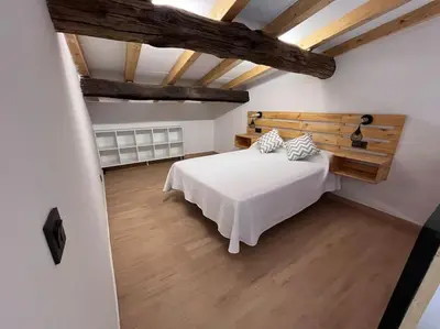 Cama o camas de una habitación en Apartamento casa rural en Abadía AT-CC-00850
