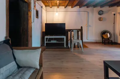 Una televisión o centro de entretenimiento en Apartamento VERAGREDOS