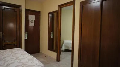 Cama o camas de una habitación en Hotel Puente Romano