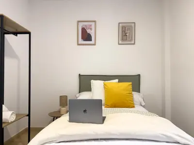 Cama o camas de una habitación en TAYP San Marcos 103