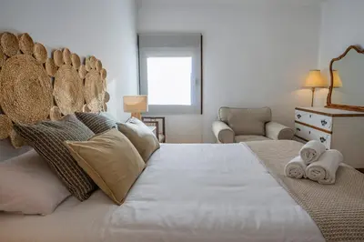 Cama o camas de una habitación en Caleros 34 Centro Histórico con patio by keyhom