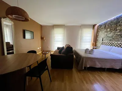 Cama o camas de una habitación en Apartamentos Suites Capitolio