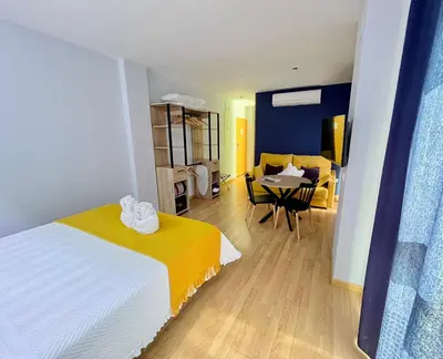 Cama o camas de una habitación en Apartamentos Suites Capitolio