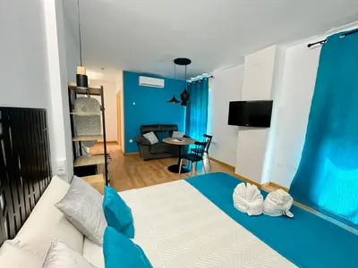 Cama o camas de una habitación en Apartamentos Suites Capitolio