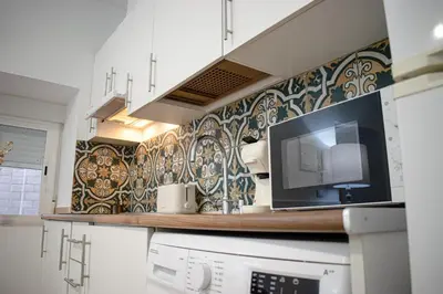 Una cocina o zona de cocina en Apartamento Turístico Diocles
