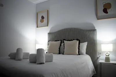Cama o camas de una habitación en Apartamento Turístico Diocles