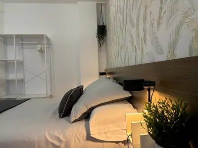 Cama o camas de una habitación en Apartamento turístico Clavero 3