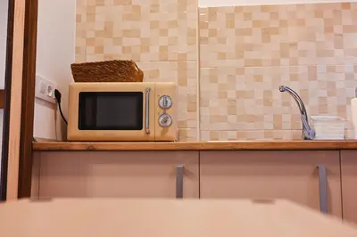 Una cocina o zona de cocina en Apartamentos El Pozo 2