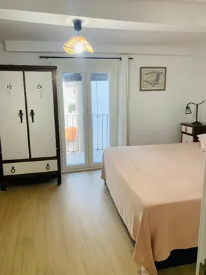 Cama o camas de una habitación en Apartamento Turístico la Casa escondida