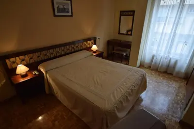 Cama o camas de una habitación en Hostal Blazquez Sanchez