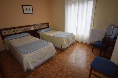 Cama o camas de una habitación en Hostal Blazquez Sanchez
