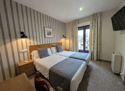 Cama o camas de una habitación en Hospedería Puerta de la Catedral