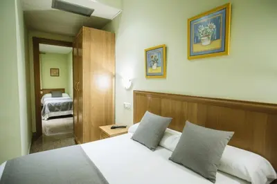 Cama o camas de una habitación en Hospedería Puerta de la Catedral