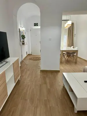 Una televisión o centro de entretenimiento en Apartamento Rei Center