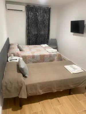 Cama o camas de una habitación en Hostal La Taberna