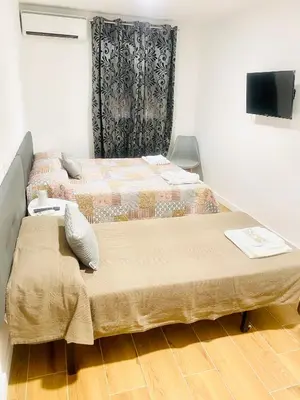 Cama o camas de una habitación en Hostal La Taberna