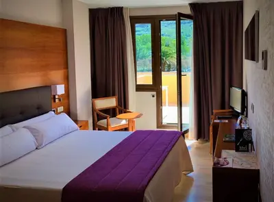 Cama o camas de una habitación en Hotel Balneario Valle del Jerte