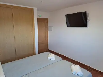 Cama o camas de una habitación en Hostal LA SIERRA