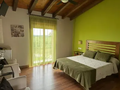Cama o camas de una habitación en Hotel Rural La Covacha