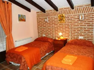 Cama o camas de una habitación en Casa Rural El Corral de la Antigua