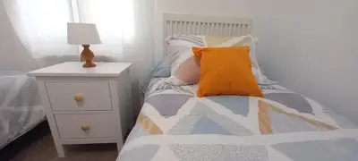 Cama o camas de una habitación en La Estrella Del Carmelo