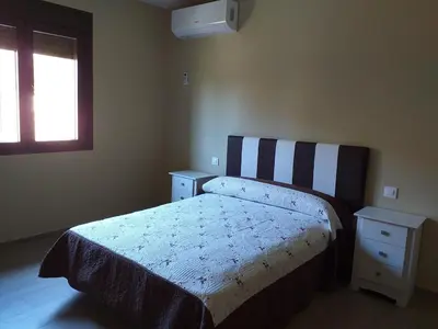 Cama o camas de una habitación en Carreras Beach Candeleda Casa en piscina natural