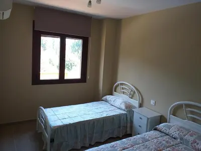 Cama o camas de una habitación en Carreras Beach Candeleda Casa en piscina natural
