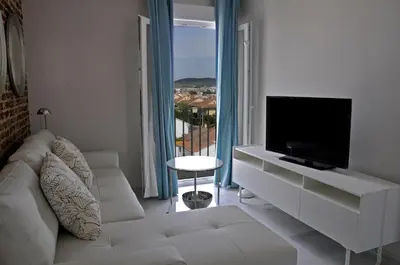 Una televisión o centro de entretenimiento en RSI Apartamentos