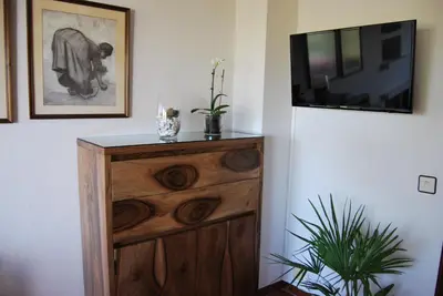 Una televisión o centro de entretenimiento en Casa rural Puente Mocho
