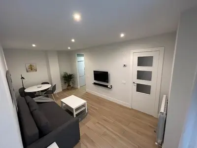 Una televisión o centro de entretenimiento en Apartamentos Dream