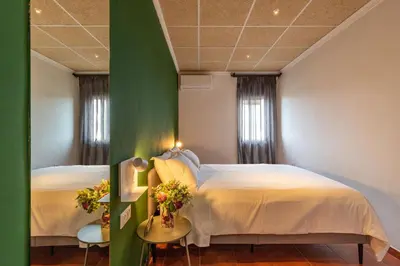 Cama o camas de una habitación en Apartamentos BICO DE NONA