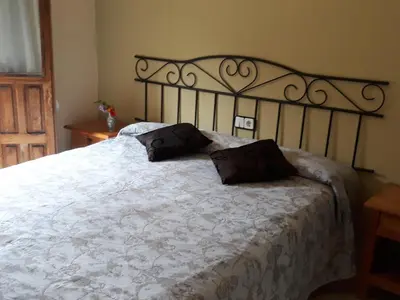Cama o camas de una habitación en Hostal Rural El Campito