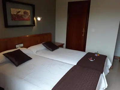 Cama o camas de una habitación en Hostal Rural El Campito