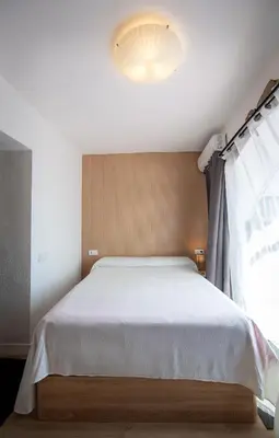 Cama o camas de una habitación en Destino Deluxe Suite Alvear Cáceres