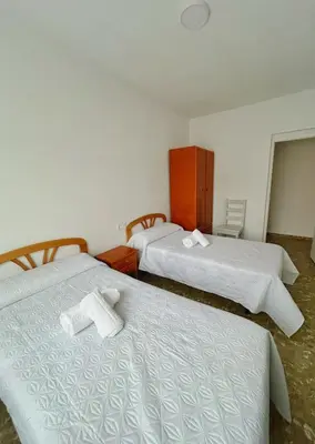 Cama o camas de una habitación en Apartamentos Turísticos Cardelemin