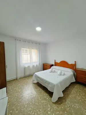Cama o camas de una habitación en Apartamentos Turísticos Cardelemin