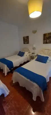 Cama o camas de una habitación en Hostal Las Cadenas
