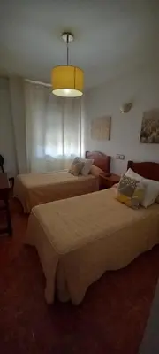 Cama o camas de una habitación en Hostal Las Cadenas