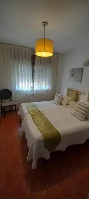 Cama o camas de una habitación en Hostal Las Cadenas