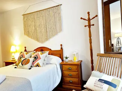 Cama o camas de una habitación en El Balcón de Serranos Centro Histórico