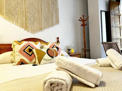 Cama o camas de una habitación en El Balcón de Serranos Centro Histórico