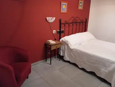 Cama o camas de una habitación en HOSTAl LUJUAN