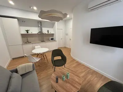 Una televisión o centro de entretenimiento en La Pata Suites