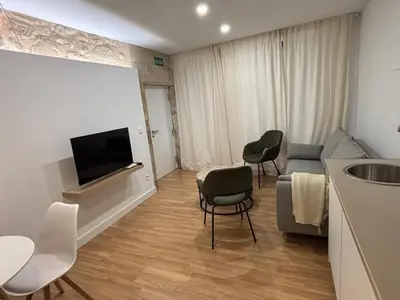 Una televisión o centro de entretenimiento en La Pata Suites