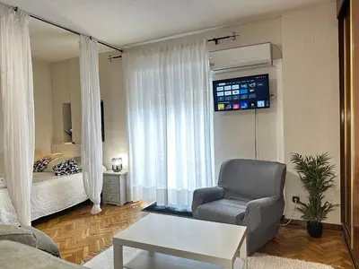 Una televisión o centro de entretenimiento en Apartamento Caldereros con Parking gratis