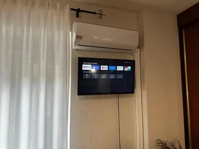 Una televisión o centro de entretenimiento en Apartamento Caldereros con Parking gratis